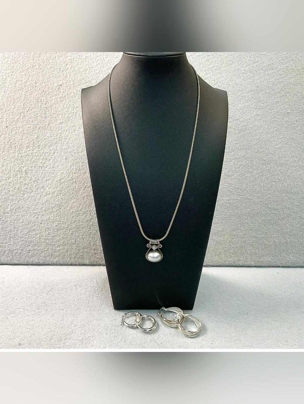 Nice, sterling silver necklace with pearl pendant and two pairs. SS Earring